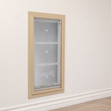 An Endura Flap pet door is installed in a wall.