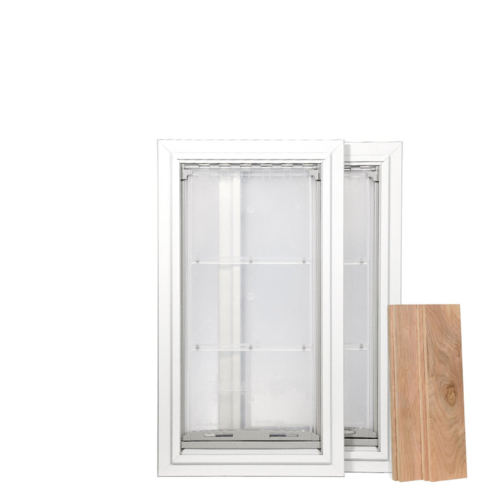 Two white framed pet doors are positioned next to a wood panel on a white background.