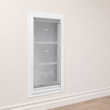 A white-framed Endura Flap pet door installed in a wall.