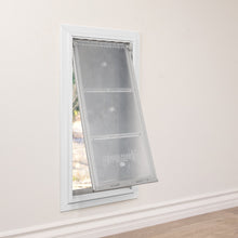 A pet door with a partially open transparent flap is installed in a white wall.