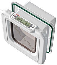 A white Cat Mate Elite pet door with a digital timer displaying 10:48 AM and a clear flap adorned with paw prints.
