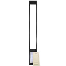 A black pet door frame with a white panel leaning against it.