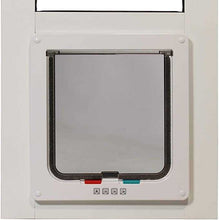 A white-framed pet door is installed in a white door.