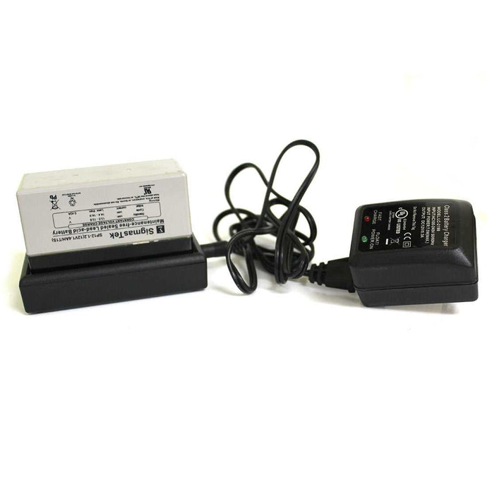 A SigmasTek battery on a charger with a coiled power cord.