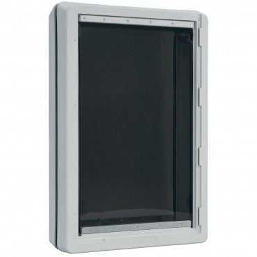 White-framed pet door with a dark, flexible flap.