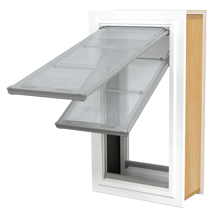 A pet door with two clear, hinged flaps is installed in a white-framed door or wall.