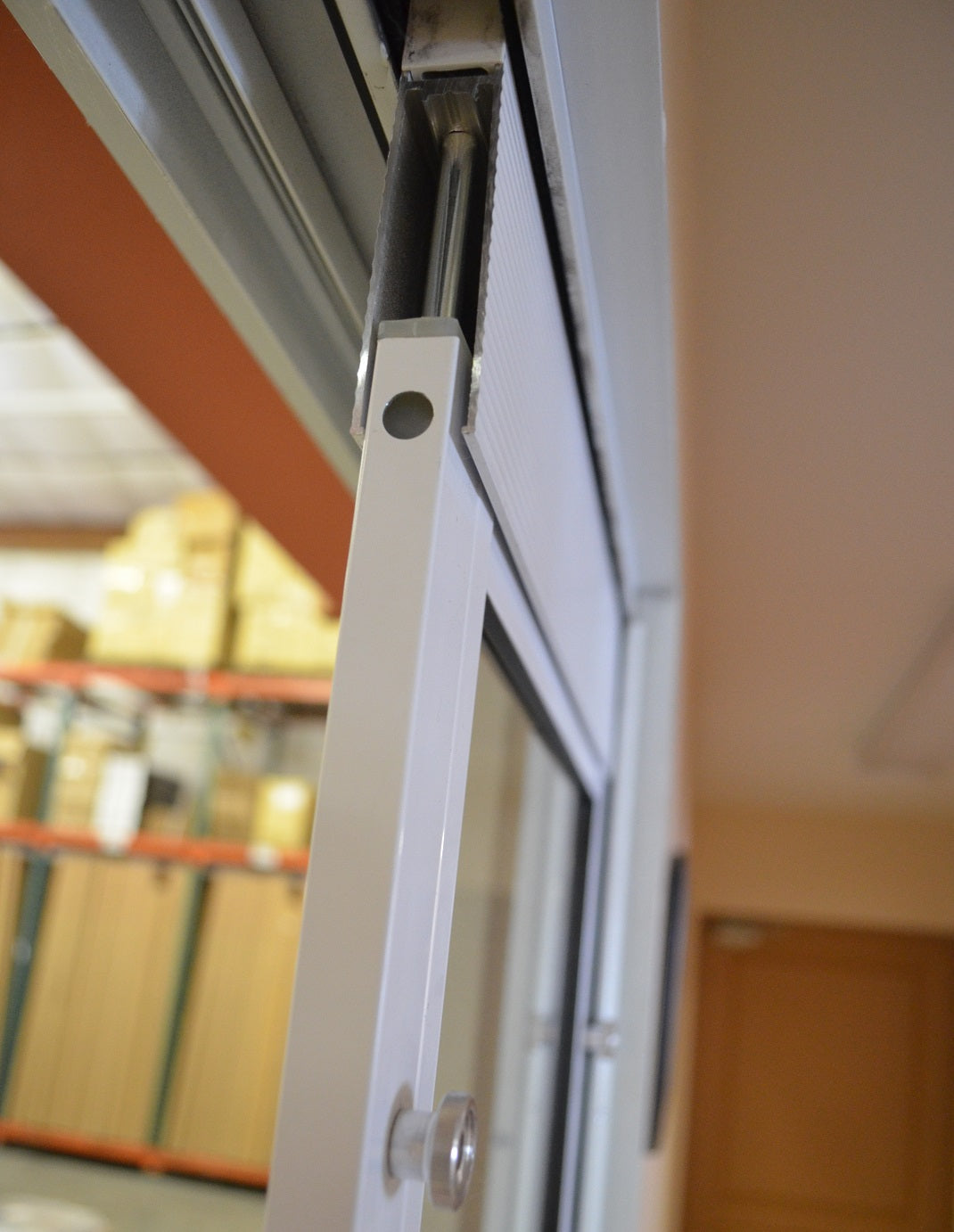 Close-up of a sliding glass door mechanism.