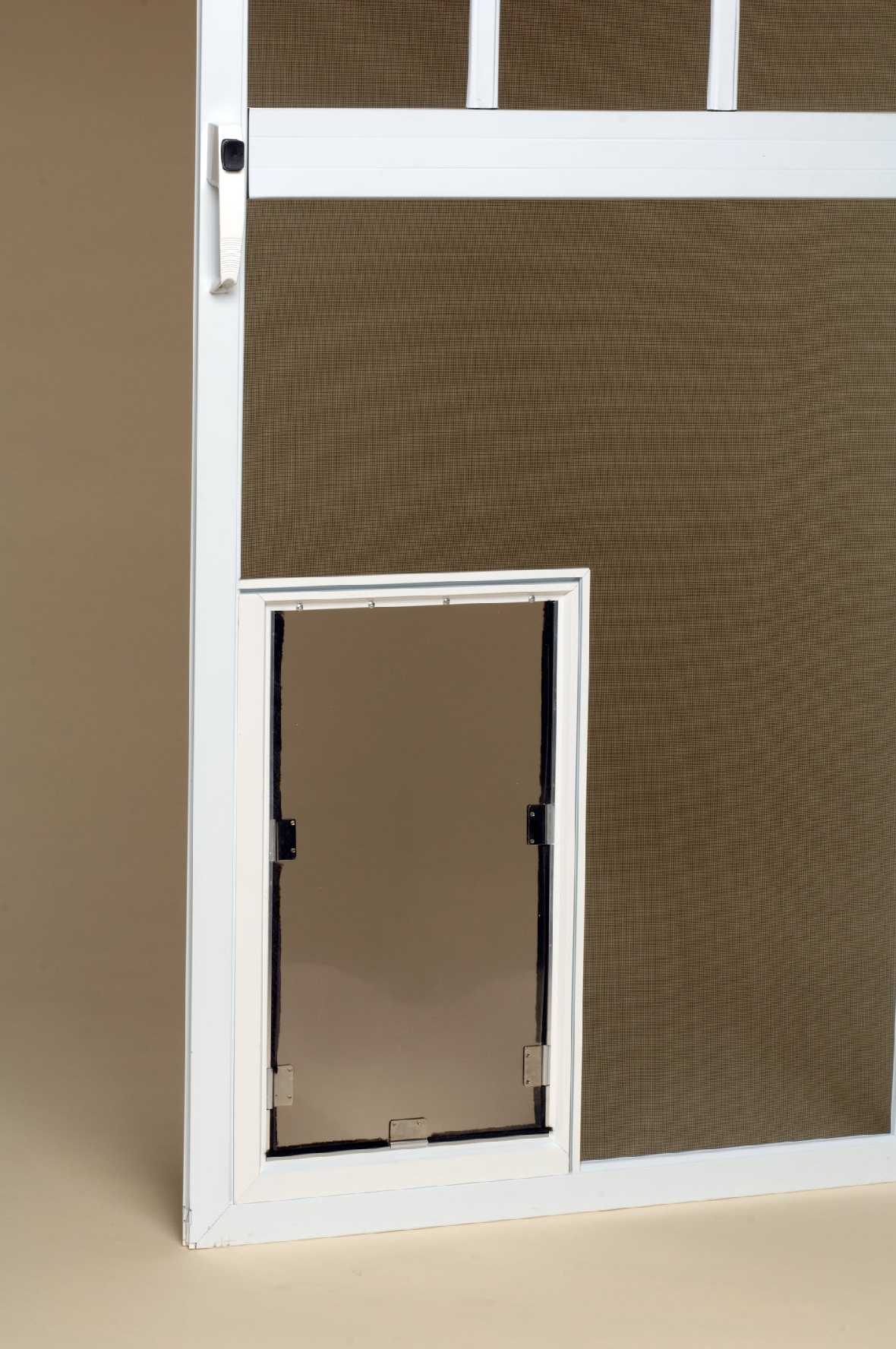 A white screen door with a pet door.