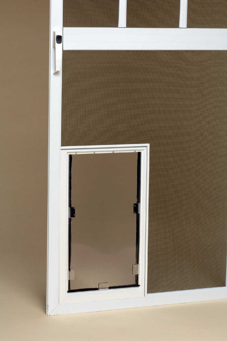 A white screen door with a pet door.