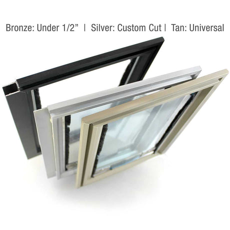 Three metal framed windows, bronze, silver, and tan, are angled up on a white surface.
