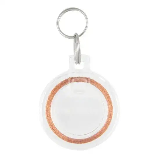 Clear plastic keychain with a metal ring and copper coil inside.