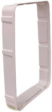 Rectangular, light-colored pet door frame.