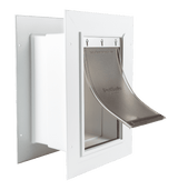 A white PetSafe pet door with a flexible tinted flap.