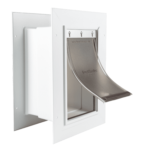 A white PetSafe pet door with a flexible tinted flap.