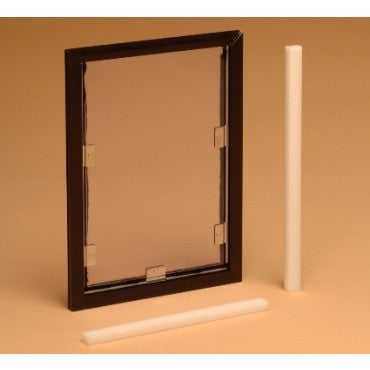 A framed clear pet door and two white cylindrical objects are displayed.