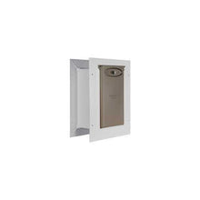 A white-framed pet door with a closed tan flap.