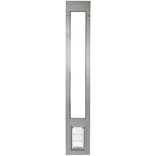A vertically oriented, stainless steel pet door insert.