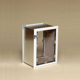 A metal box with a clear door and white frame is ajar.