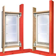 Two Endura Flap pet doors are installed in wood framing.