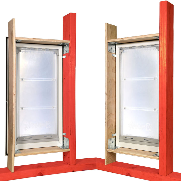Two Endura Flap pet doors are installed in wood framing.