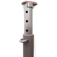 A gray adjustable pole with holes and a hook.