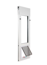 A white dog door insert for a sliding glass door, with a partially open transparent flap.